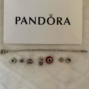 Pandora Sterling Silver Bracelet with 7 Charms.